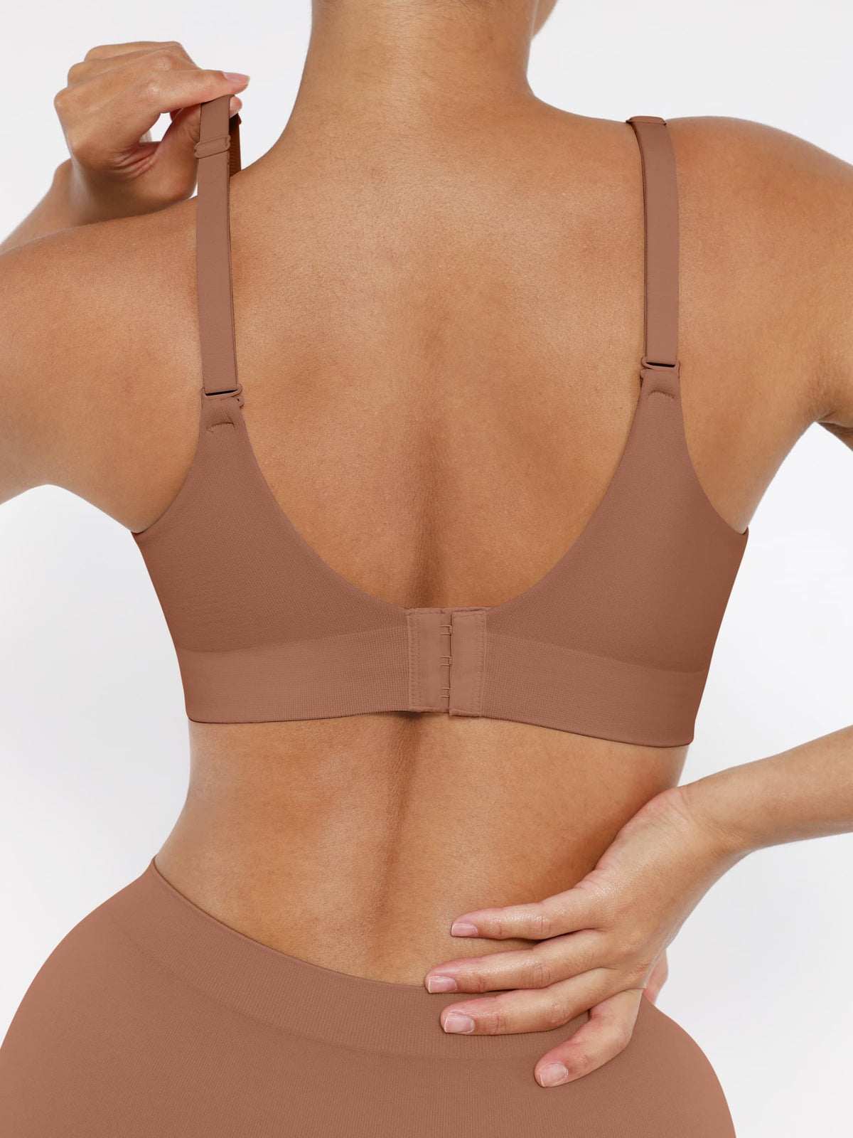 Wireless bra with seamless design for comfort and support, featuring a backless, waist-sculpting effect.
