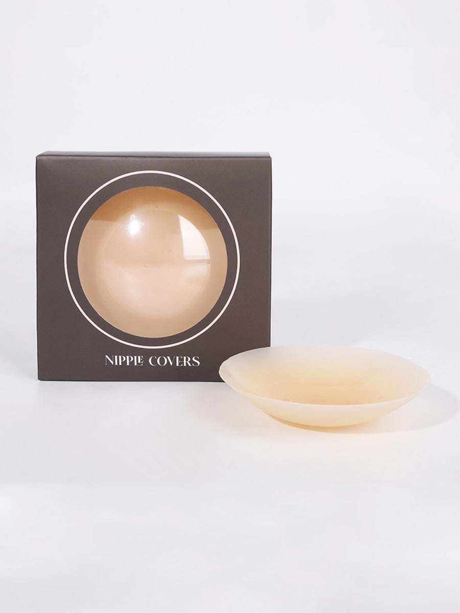 Invisible non-slip nipple covers beside product packaging, ultra-thin and seamless design.
