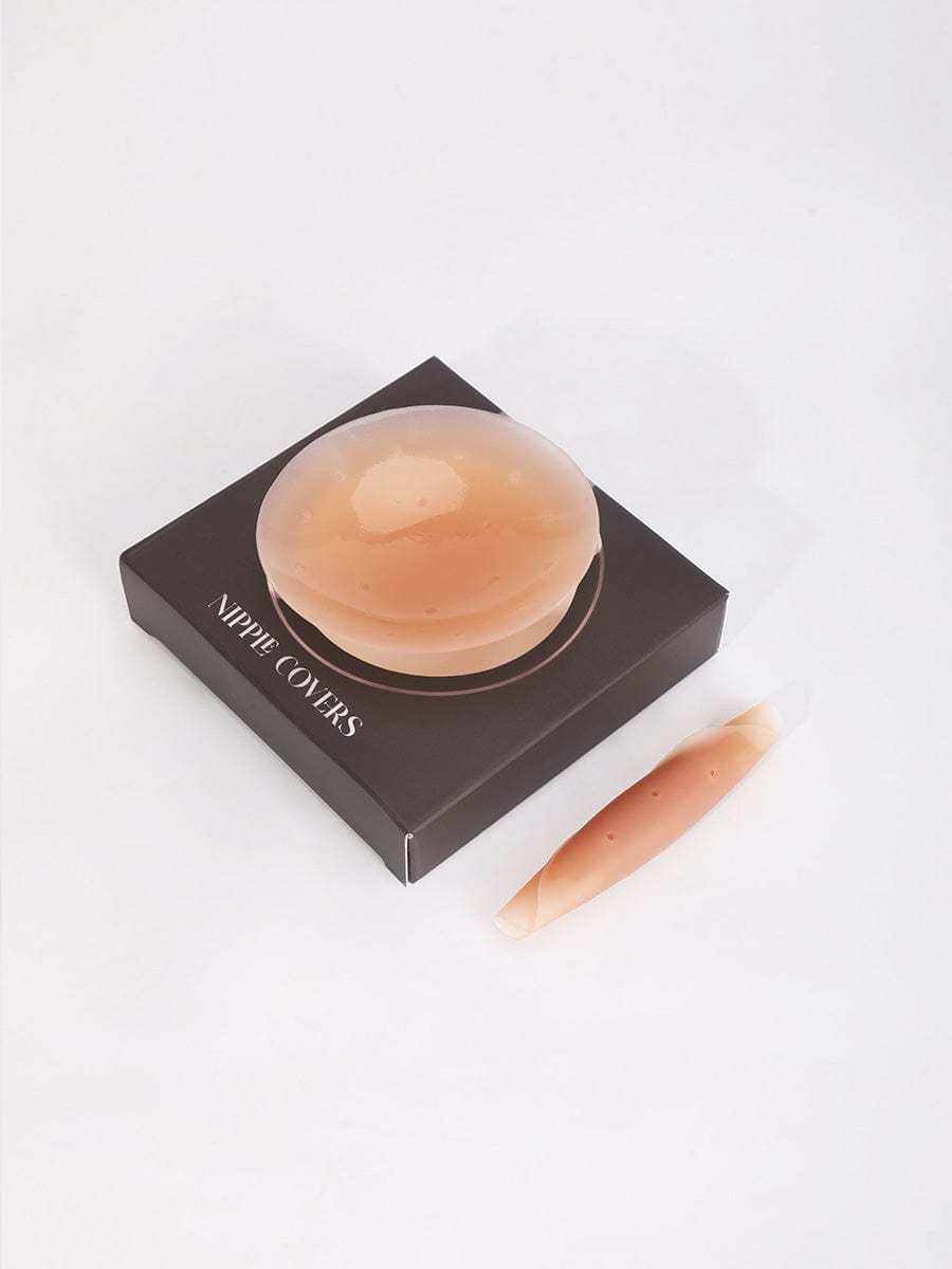 Invisible non-slip nipple covers on black packaging for discreet, comfortable support.