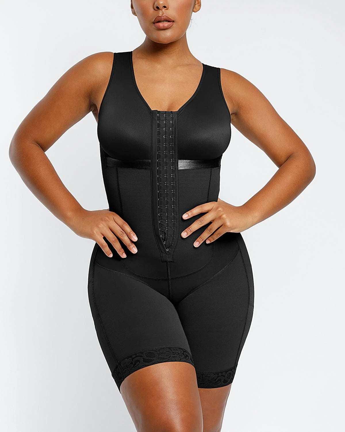 Woman wearing black body sculpting shaper enhancing curves.