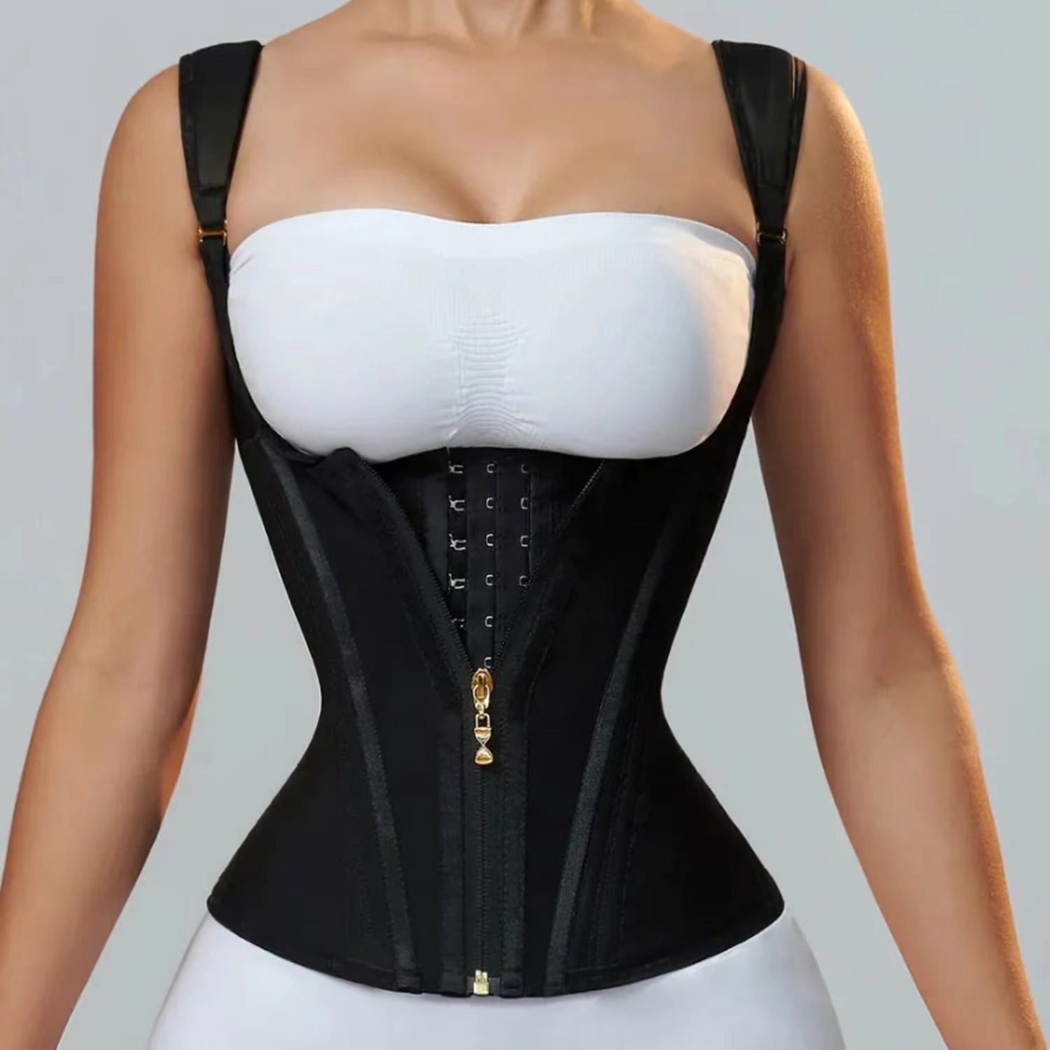 black zipper breasted retro shapewear top with adjustable straps and hook closure on model